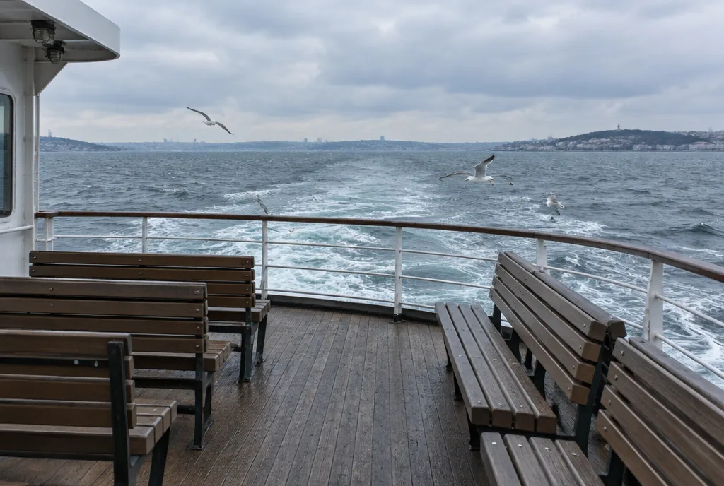 A crowded ferry deck on the water near Eminönü, Istanbul